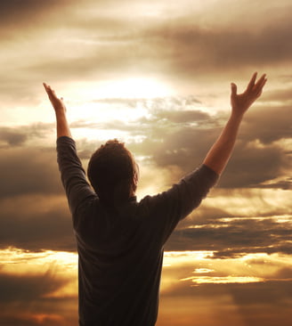 Man LIfint Hands in Praise